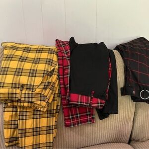 Three pair of size small Hot Topic pants with chains.